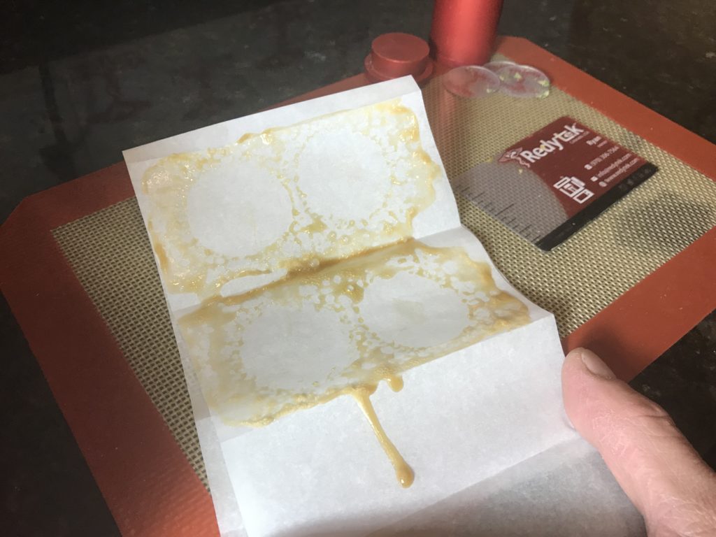 Turning Ellensburg Dispensary flower into gold solventless concentrate using Rosin technique and Redytek rosin press Washington