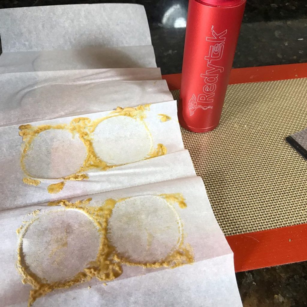 Turning Helena Dispensary flower into gold solventless concentrate using Rosin technique and Redytek rosin press Montana